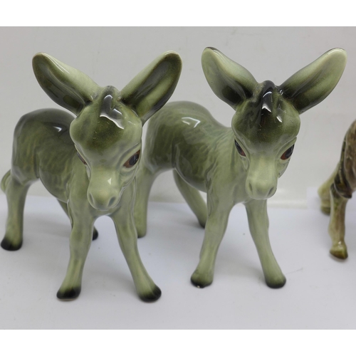 705 - Eight models of donkeys, Goebel x2, Beswick, Kaiser, etc., a/f