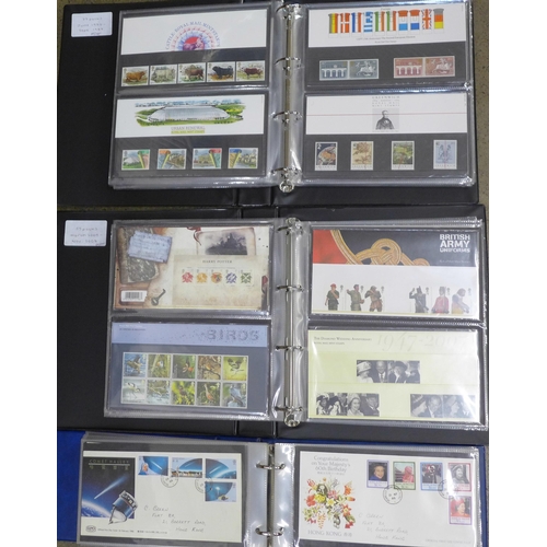 708 - A collection of approximately 130 Royal Mail mint stamp packs and a collection of First Day Covers