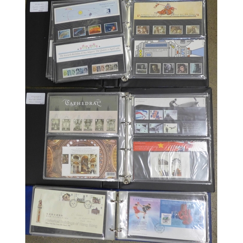 708 - A collection of approximately 130 Royal Mail mint stamp packs and a collection of First Day Covers