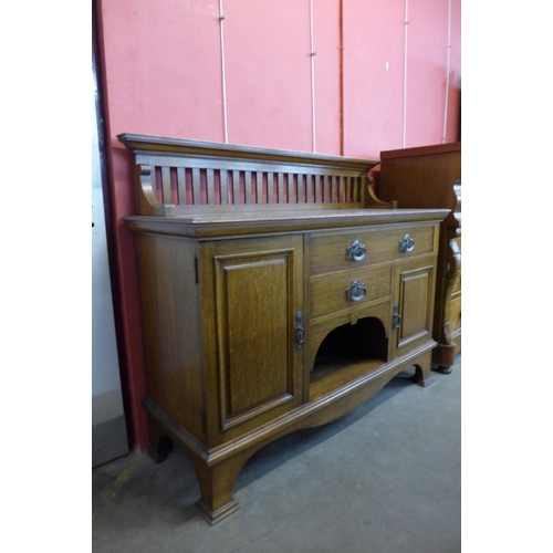 26 - An Arts and Crafts Maple & Co. Ltd. oak sideboard