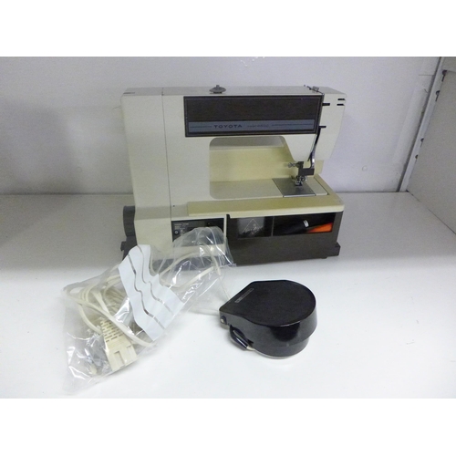 2168 - Toyota computerised sewing machine in case with pedal - W