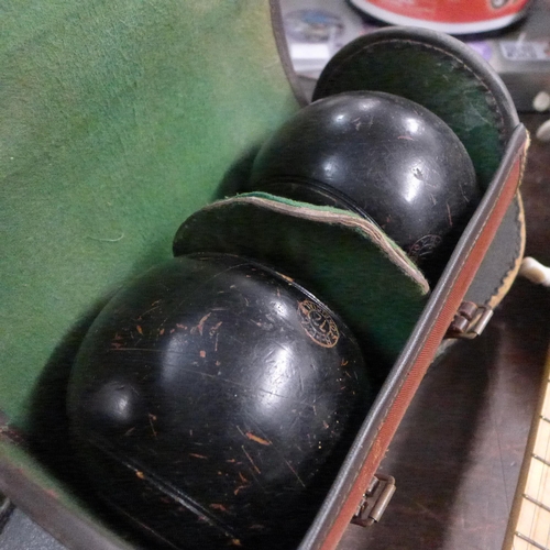 2178 - 2 Sets of lawn green bowls with carry cases