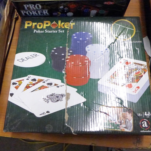 2186 - Three poker sets, one with poker mat