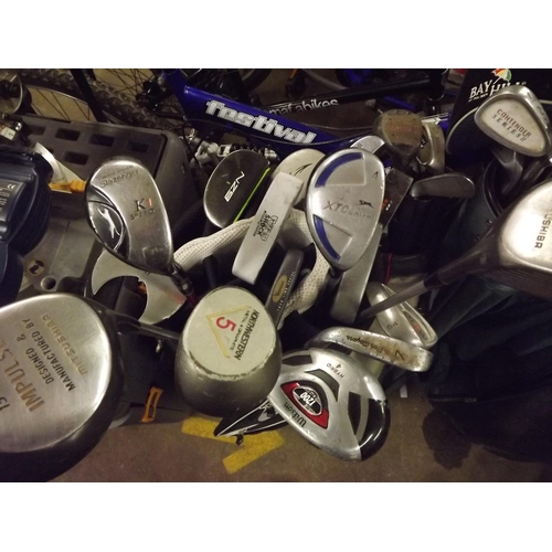 2330 - 4 Golf bags with qty. of golf clubs