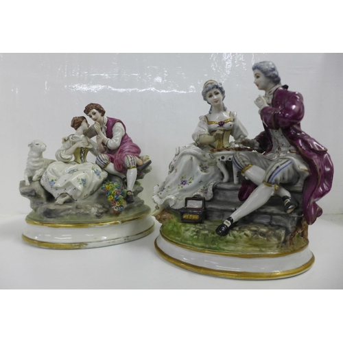 612 - Two German porcelain figure groups; couple in conversation, with lamb and couple playing chess, both... 