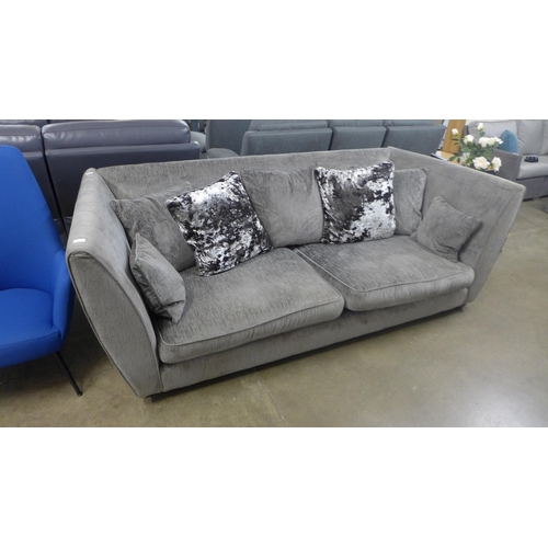 1472 - A designer grey upholstered three seater sofa -  Ex display