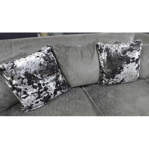 1472 - A designer grey upholstered three seater sofa -  Ex display