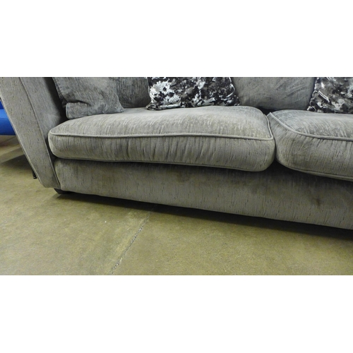 1472 - A designer grey upholstered three seater sofa -  Ex display