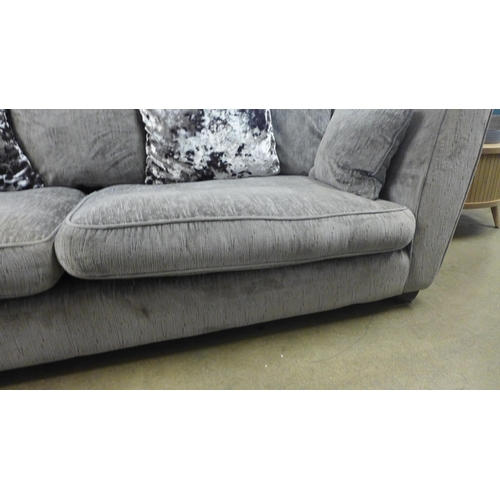 1472 - A designer grey upholstered three seater sofa -  Ex display