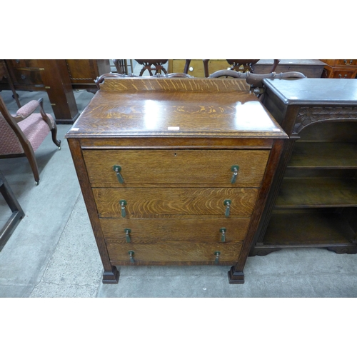 109 - An Art Deco oak chest of drawers