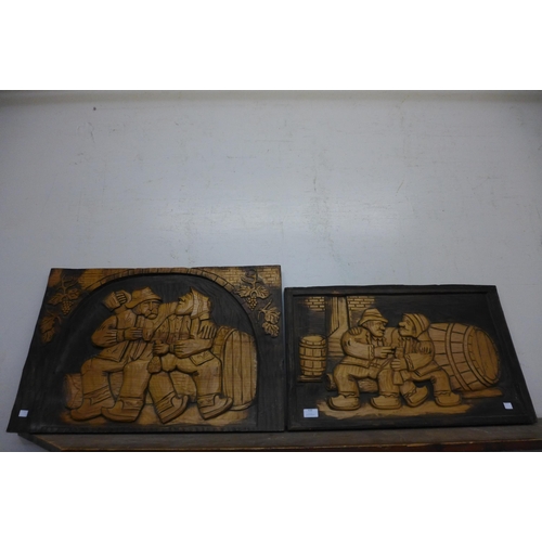 438 - A pair of Flemish carved wood panels