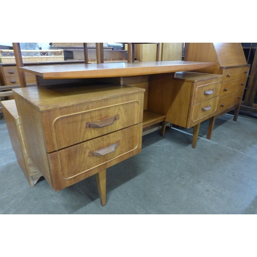 66 - A teak top desk