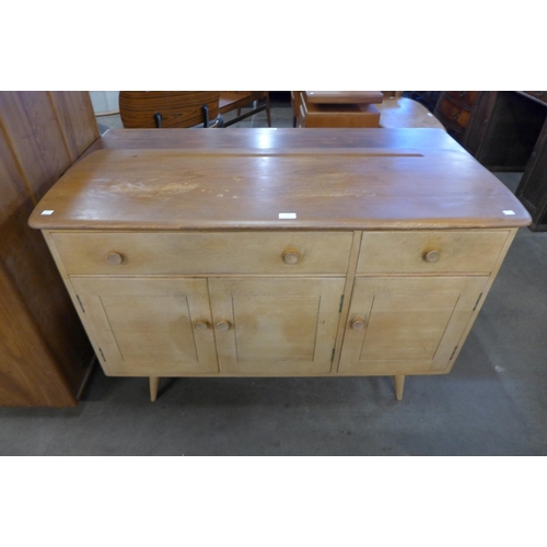 76 - An Ercol Blonde elm and beech 351 model sideboard