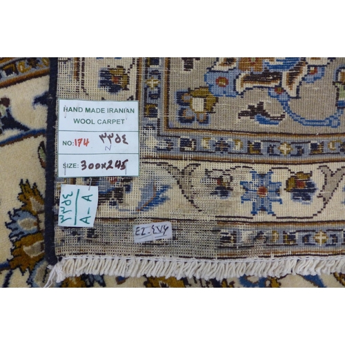 7B - A large Persian cream ground Khorasan rug, 300 x 245cms