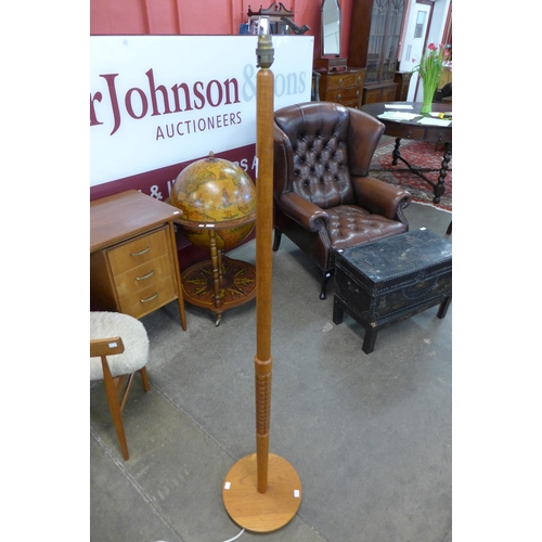 88 - A teak standard lamp