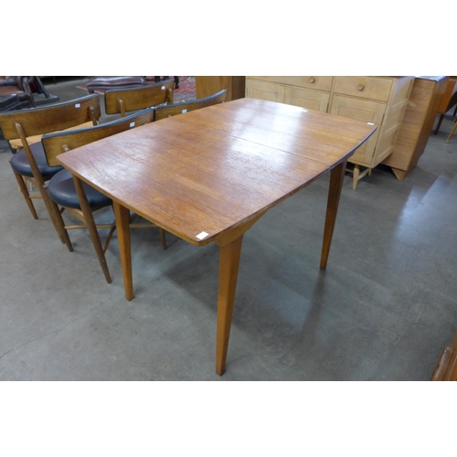 95 - A teak extending dining table