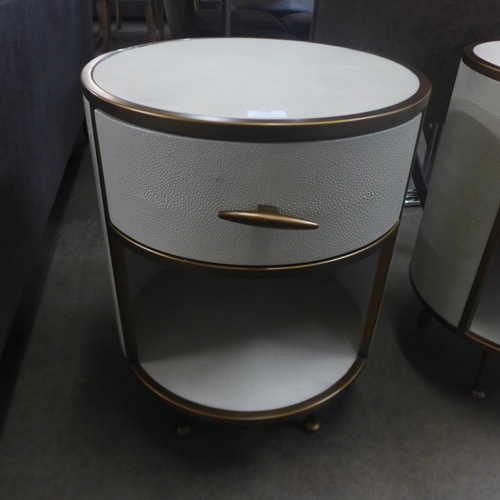 1438 - A pair of drum bedside tables, marked   *This lot is subject to VAT