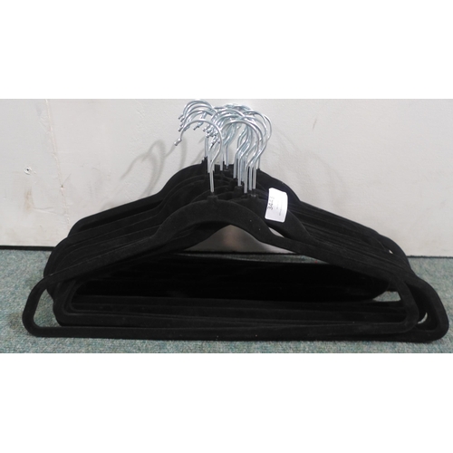 3443 - Quantity of Black Flocked Coat Hangers * This lot is subject to VAT