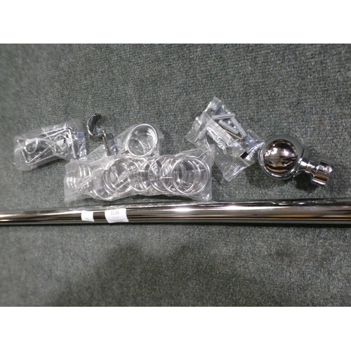3136 - A chrome curtain pole and curtain hoops, 157cm long * this lot is subject to VAT