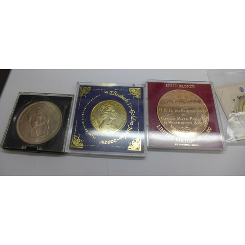 901 - A collection of commemorative coins including one silver 1973 Royal wedding coins, (folders not comp... 