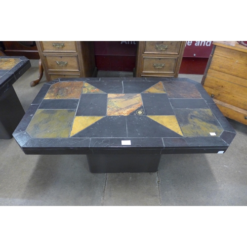 107 - A South African Brutalist slate topped coffee table, in the style of Paul Kingma