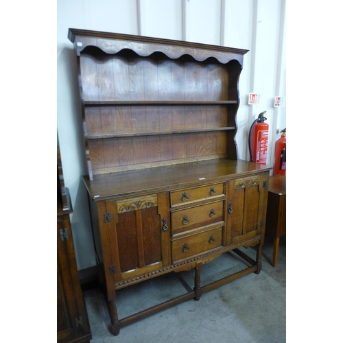 294 - A carved oak dresser