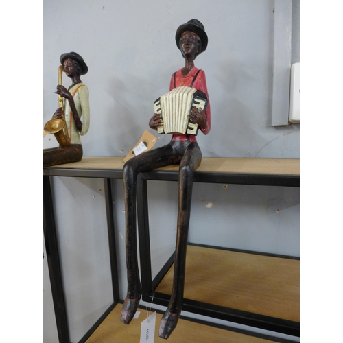 1308 - A sitting jazz band squeeze box player, 40cms (026312)   #
