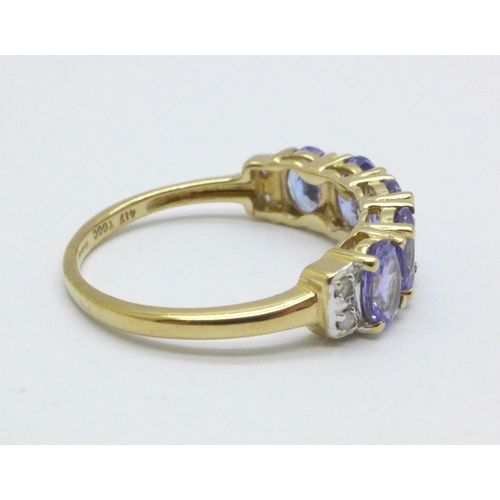 1002 - A 9ct gold, tanzanite and diamond ring, 2.0g, L