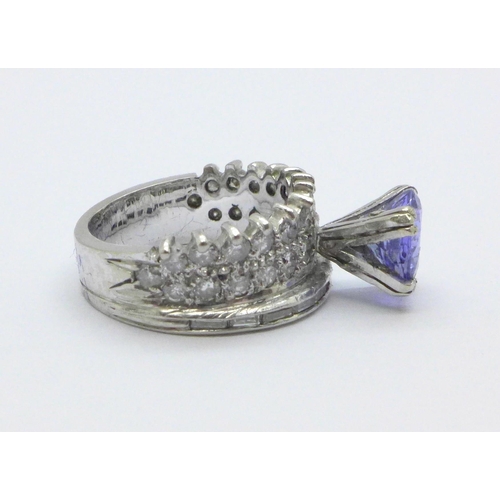 1012 - A 18ct white gold, tanzanite and 38 diamond cocktail ring, 5.2g, I