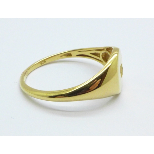 1014 - A silver gilt and diamond set signet ring, 2.5g, W