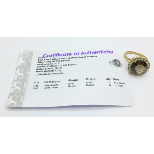 1021 - A silver gilt, olive quartz and white topaz ring with certificate, 4.9g, N