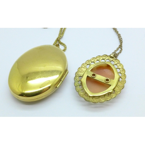 1023 - A large rolled gold locket and chain and a rolled gold cameo pendant and chain