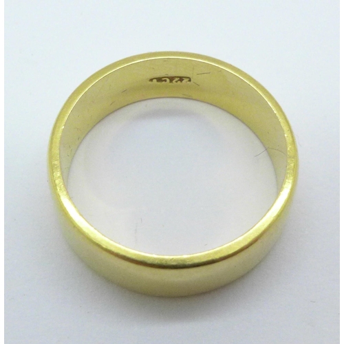 1028 - A 22ct gold wedding band, 6.7g, M