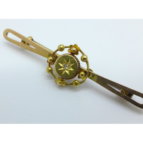 1029 - A 9ct gold and diamond bar brooch, with original fitted box, 2.0g