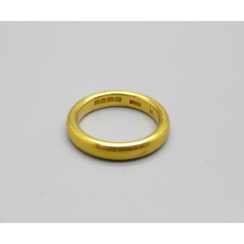 1034 - A 22ct gold wedding band, 8.4g M