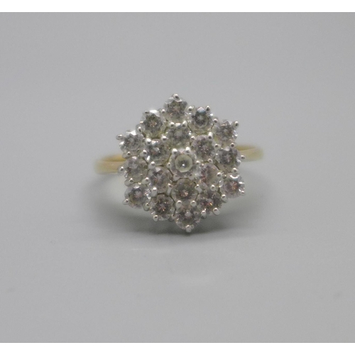 1037 - A 9ct gold and cubic zirconia cluster ring, 2.6g, P