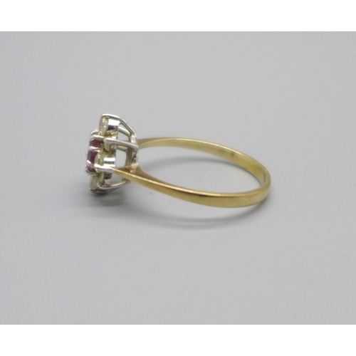 1038 - A 9ct gold ring, set with a ruby and white stones, 1.6g, N