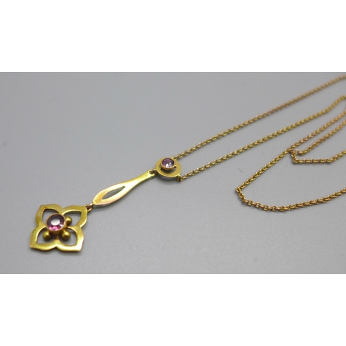 1051 - An Edward VII 9ct gold pendant set with amethysts, on a 9ct gold chain, 2.2g