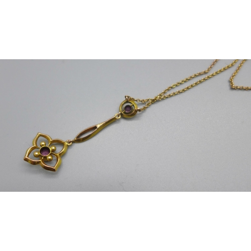 1051 - An Edward VII 9ct gold pendant set with amethysts, on a 9ct gold chain, 2.2g