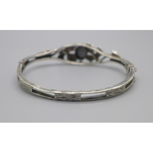 1084 - An Arts and Crafts silver and hematite bangle, Shipton & Co Birmingham, 19.6g