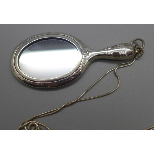 1085 - A 925 silver pendant in the form of a hand mirror on a silver chain