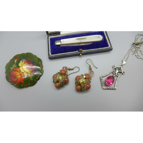 1099 - A silver and mother of pearl fruit knife, a pair of goldstone earrings, a pendant and chain and a br... 