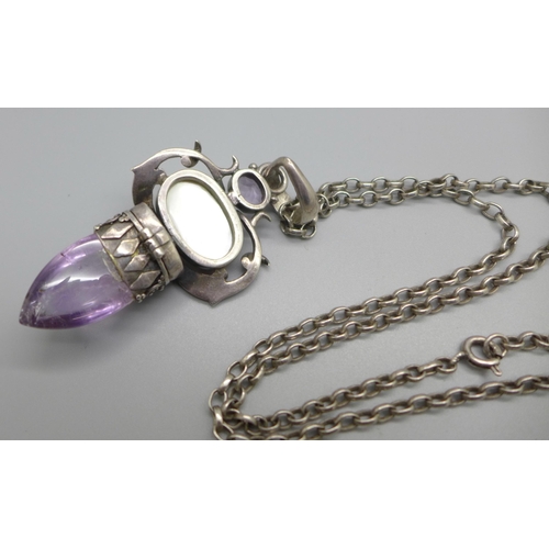 1102 - A large 925 silver 'poison' pendant on a silver chain