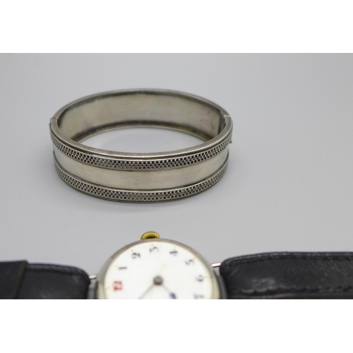 1108 - A c1900 white metal bangle, a necklet and a silver cased wristwatch