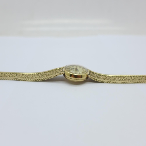 1109 - A lady's 9ct gold Omega wristwatch, 18.3g with movement