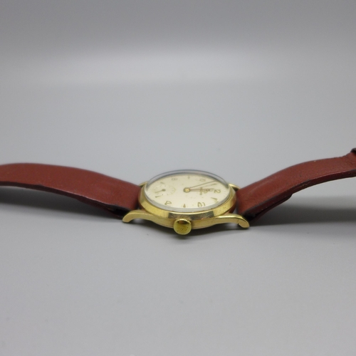 1113 - A 9ct gold Record wristwatch, the case back bears inscription dated 1957, 31mm case