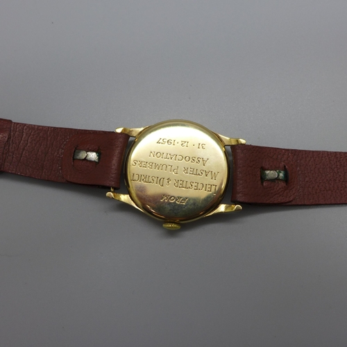 1113 - A 9ct gold Record wristwatch, the case back bears inscription dated 1957, 31mm case