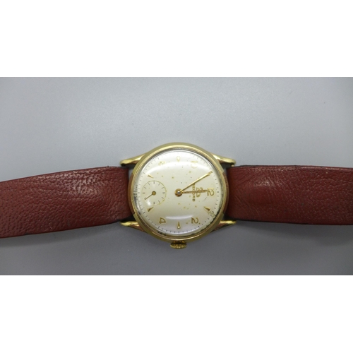 1113 - A 9ct gold Record wristwatch, the case back bears inscription dated 1957, 31mm case