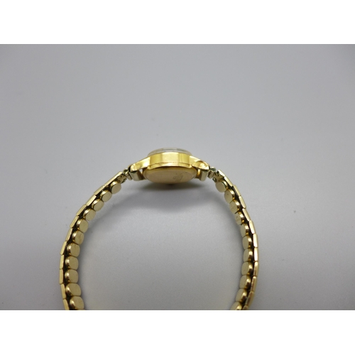 1125 - A lady's 18ct gold cased MuDu wristwatch on an expanding rolled gold bracelet strap