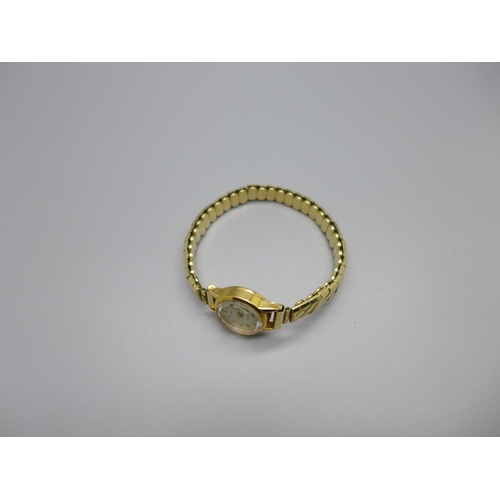 1125 - A lady's 18ct gold cased MuDu wristwatch on an expanding rolled gold bracelet strap